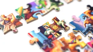 High-end puzzle pieces precisely interlocked together with vibrant, detailed artwork visible, professional photography lighting, minimalist white background, shallow depth of field focusing on piece connections